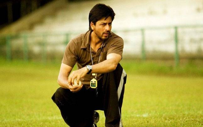 What is the profession of Shah Rukh Khan in Chak De India?